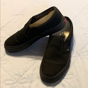 U.S. Kids size 2, all black slip on Vans.
